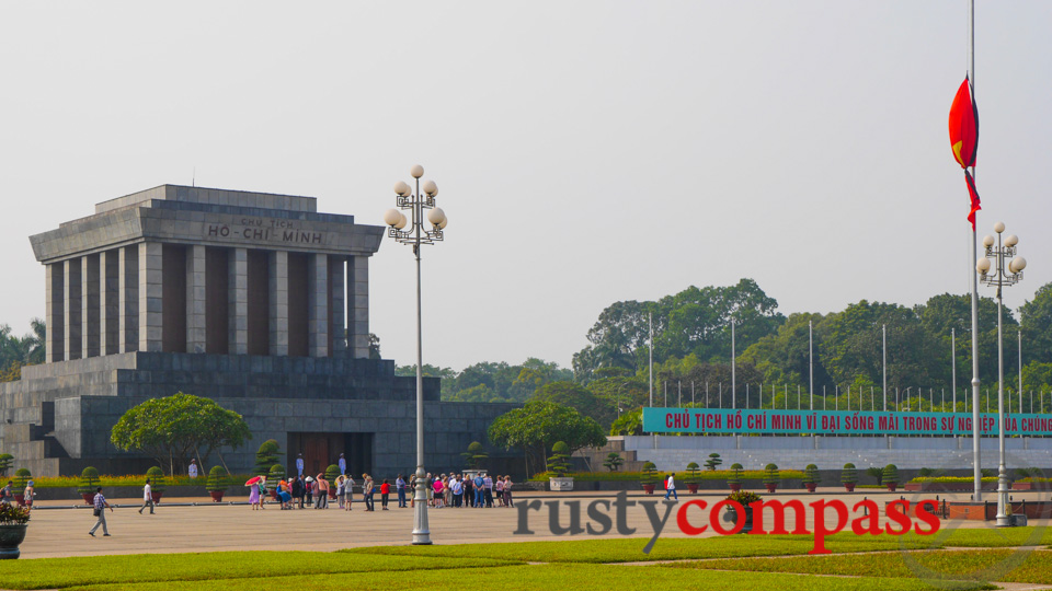 A tied Vietnamese flag at half mast overlooking Ho Chi Minh's Mausoleum.
